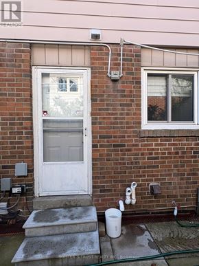 Toronto (Agincourt North) apartment for rent - A white door is on the left side of a brick wall.