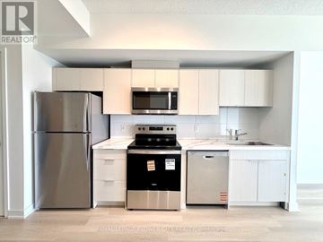 Toronto (Glenfield-Jane Heights) condo for rent - A kitchen with a refrigerator, oven, and microwave.