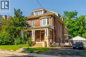 Hamilton apartment for rent - A large two-story house with a brick facade and a white trim.