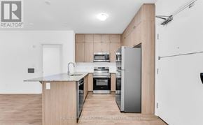 Milton (Walker) condo for rent - A modern kitchen with a marble countertop and stainless steel appliances.