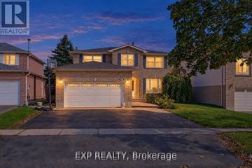 Oshawa (Northglen) apartment for rent - A house with a driveway and garage is shown in the image.