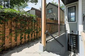 Toronto (Blake-Jones) apartment for rent - A wooden fence with green vines growing on it.