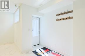 Toronto (Blake-Jones) apartment for rent - A room with a door and a wall with hooks.