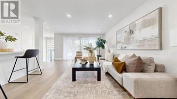 Toronto (Humbermede) apartment for rent - A living room with a couch, chair, and a painting on the wall.