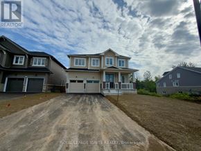 Loyalist (Bath) apartment for rent - A house under construction with a sign that says "REALTOR" in the foreground.