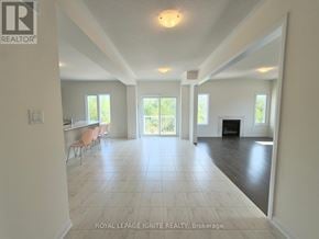Loyalist (Bath) apartment for rent - A spacious living room with a fireplace and sliding glass doors.