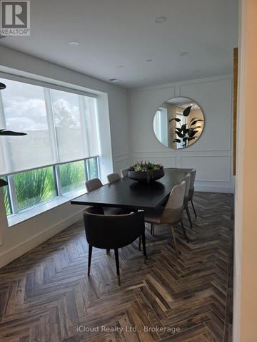 London North (North R) condo for rent - A dining room with a round table and chairs.