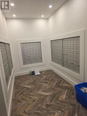 London North (North R) condo for rent - A hallway with a wooden floor and a calendar on the wall.
