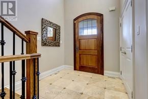 Toronto (Islington-City Centre West) apartment for rent - A wooden door with a glass window is in the middle of a hallway.