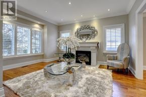 Toronto (Islington-City Centre West) apartment for rent - A living room with a fireplace and a chair.
