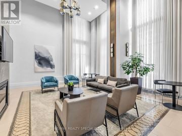 Mississauga (City Centre) condo for rent - A living room with a couch and a television.
