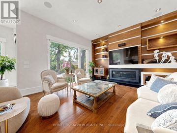 Toronto (Newtonbrook East) apartment for rent - A living room with a glass coffee table and a white couch.