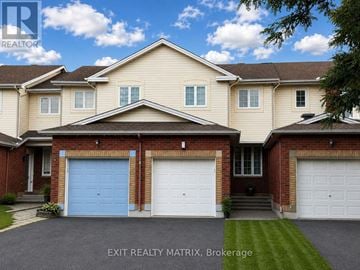 Ottawa townhouse for rent - A house with a blue garage door is for sale in Brokerage.