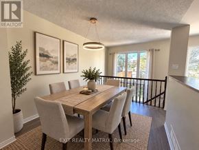 Ottawa townhouse for rent - A dining room with a wooden table and chairs.