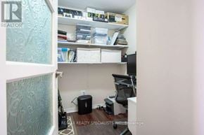 Burlington (Roseland) condo for rent - A room with a desk, chair, and shelves with various items.