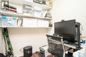 Burlington (Roseland) condo for rent - A room with a desk, chair, and a computer monitor.