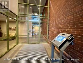 Toronto (Waterfront Communities) condo for rent - A brokerage office with a brick wall and a glass door.
