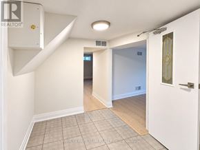 Pickering (Bay Ridges) apartment for rent - A room with a white door and a window in the background.