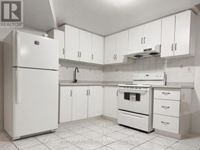 Markham (Milliken Mills East) apartment for rent - A white kitchen with a refrigerator, oven, and cabinets.