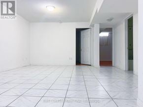 Markham (Milliken Mills East) apartment for rent - A white tiled room with a door and a window.