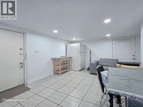 Burnaby apartment for rent - A room with a white door and a table with a cloth on it.
