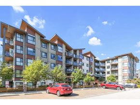 Langley apartment for rent - A red car is parked in front of a multi-story apartment building.