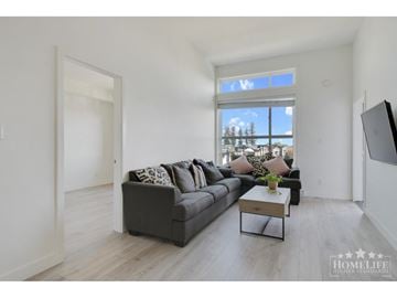 Langley apartment for rent - A living room with a grey couch and a coffee table.