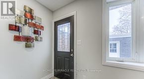 Kitchener apartment for rent - A wall decoration made of metal plates is mounted on a white wall.