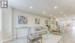 Kitchener apartment for rent - A living room with a glass table and white couches.
