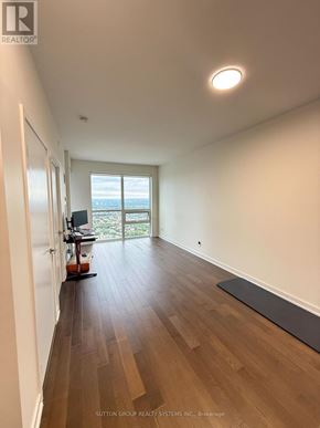 Mississauga (Creditview) condo for rent - A room with wooden flooring and a large window.