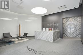 Ottawa condo for rent - A reception area with a desk and two chairs.