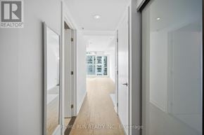 Ottawa condo for rent - A hallway with a glass door at the end.
