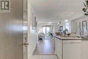 Toronto (Eglinton East) condo for rent - A realtor's office with a view of a kitchen and living room.
