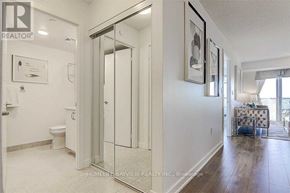 Toronto (Eglinton East) condo for rent - A bathroom with a toilet, sink, and mirror.