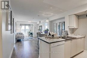 Toronto (Eglinton East) condo for rent - A well-lit kitchen with white cabinets and a marble countertop.