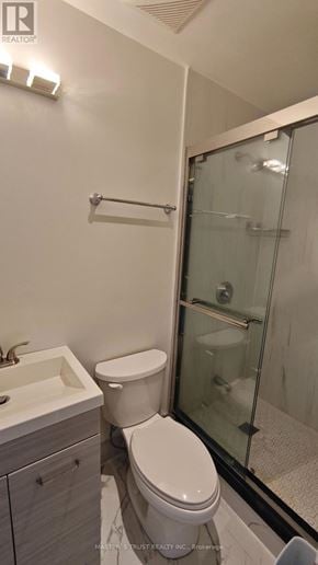 Toronto (Pleasant View) apartment for rent - A white toilet sits next to a sink in a bathroom.