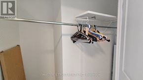 Toronto (Pleasant View) apartment for rent - A row of clothes hanging on a rail in a closet.