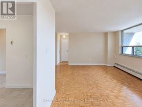 Toronto (Eglinton East) condo for rent - A room with wooden flooring and white walls, with a window on the right side.