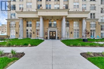 Hamilton (Corktown) condo for rent - A building entrance with a walkway leading to it.
