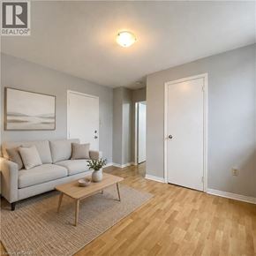 London apartment for rent - A living room with a couch, coffee table, and two doors.