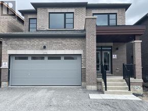 Oshawa (Kedron) apartment for rent - A modern house with a grey garage door is for sale.
