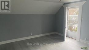 Whitchurch-Stouffville (Stouffville) apartment for rent - A room with a door leading to a balcony.