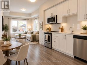Kitchener condo for rent - A hallway with a wooden floor leads to a kitchen.