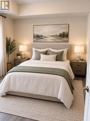 Kitchener condo for rent - A bedroom with a large bed and a painting on the wall.