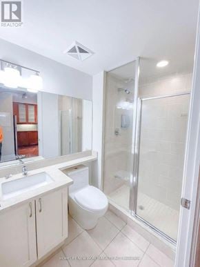 Markham (Unionville) condo for rent - A bathroom with a toilet, sink, and shower.