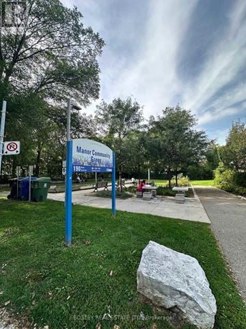 Toronto (Mount Pleasant East) apartment for rent - A sign for Manor Community Green is displayed in front of a grassy area.