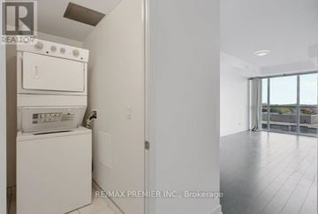 Burlington (Orchard) condo for rent - A white dishwasher and oven in a kitchen.