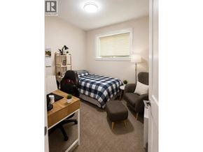 Coquitlam apartment for rent - A bedroom with a bed, desk, and chair.