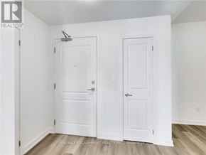 Hamilton (Waterdown) condo for rent - A white door with a small window above it.
