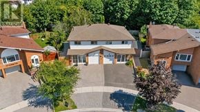 Toronto (Malvern) apartment for rent - A bird's eye view of a residential area with houses and trees.